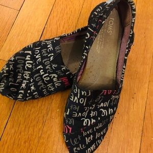Black Toms shoes with print
